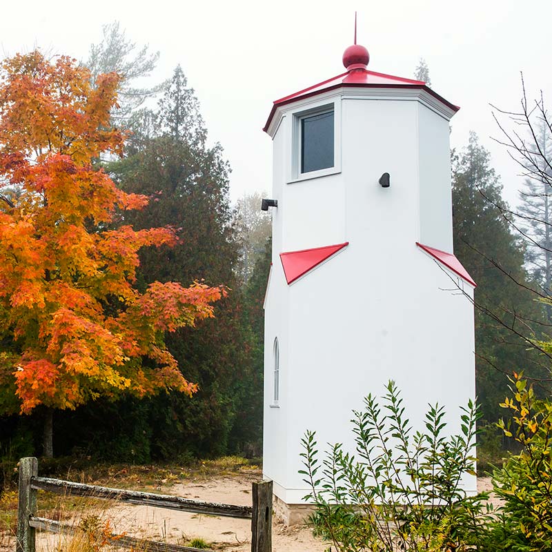 Peninsula State Park lighthouse in Door County, Wisconsin. Fall colors